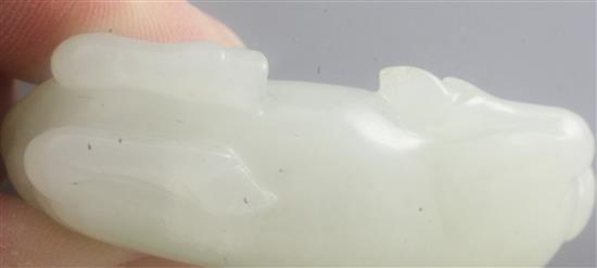 A Chinese white jade figure of a recumbent horse, 18th / 19th century, length 5.4cm